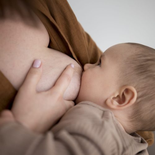 young-woman-breastfeeding-her-cute-baby